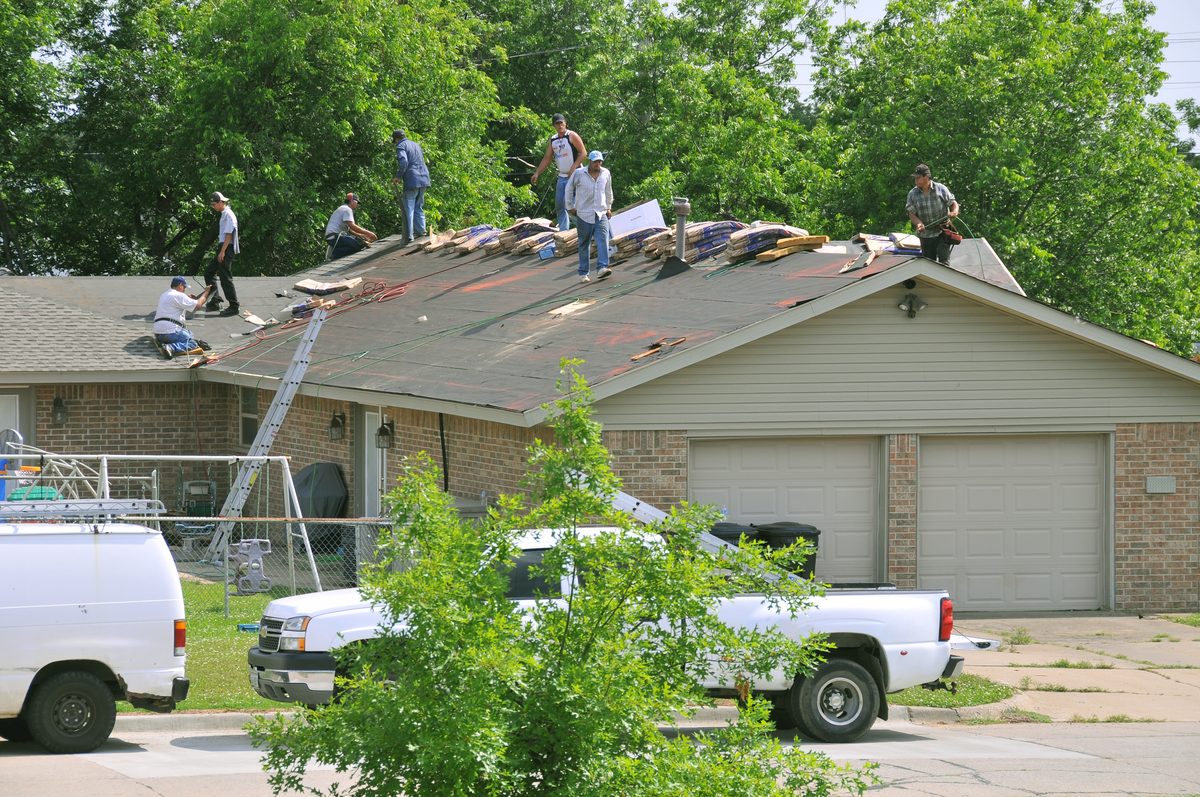 Roof repair crew carrying out commercial roof repair in London, Ontario