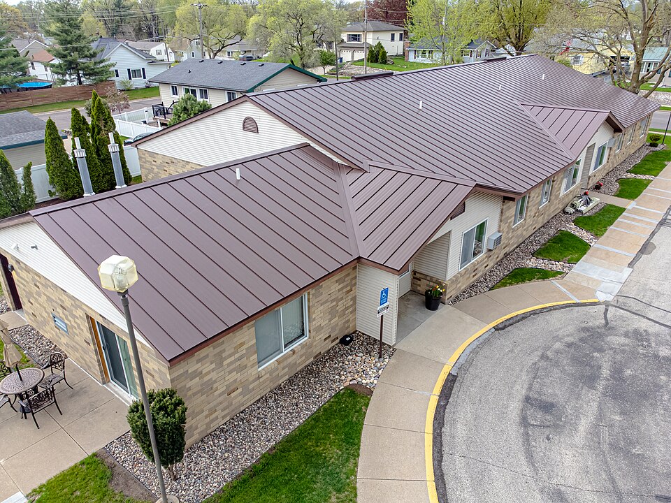 Standing seam metal roof on a sloped commercial building